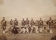 Scottish soldiers with Indian men at a military encampment (during the ...