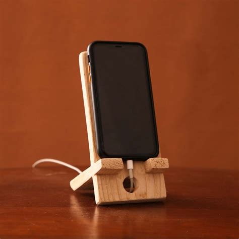 Wooden Phone Stand | Who We Are