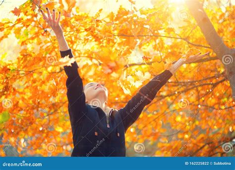 Autumn Model Girl Spinning and Laughing in Autumnal Park, Forest, Throws Colorful Leaves ...
