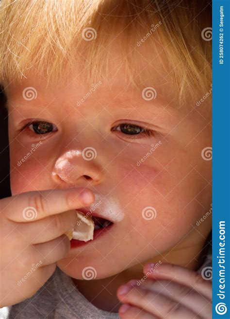 Cute Blond Child Eating Ice Cream Close Up Portrait Stock Photo - Image of close, toddler: 258074262
