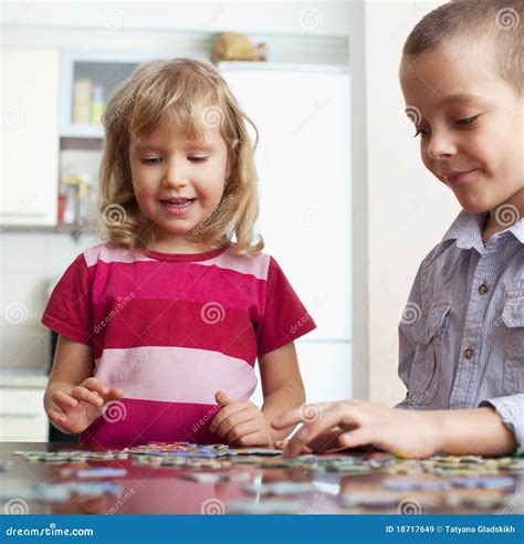 Children, playing puzzles stock image. Image of people - 18717649