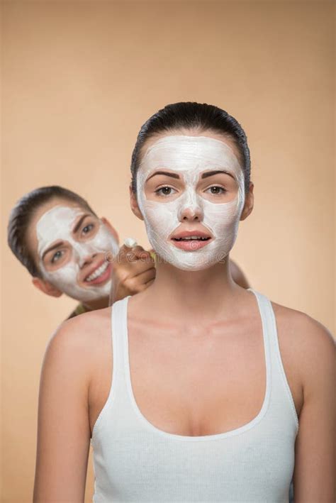 Two Beautiful Girls Applying Facial Cream Mask and Stock Image - Image ...