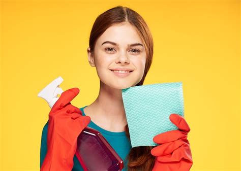Premium Photo | Cleaning lady with detergent work yellow background positive person
