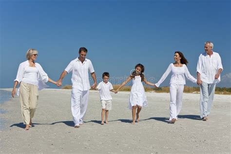 Generations of Family Holding Hands on Beach Stock Photo - Image of ...