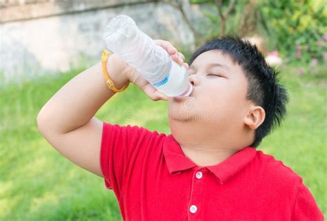 Asian Fat Boy Drinking Water Stock Photos - Free & Royalty-Free Stock Photos from Dreamstime