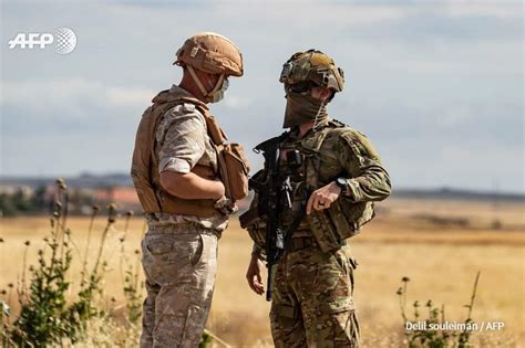 A US Army Infantryman talks to a Russian Army MP. M4 Highway, Syria ...