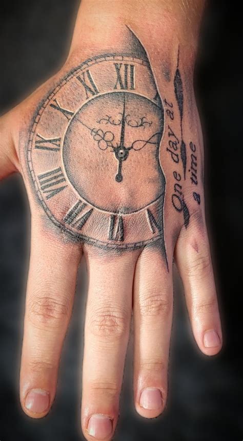 Clock on hand tattoo