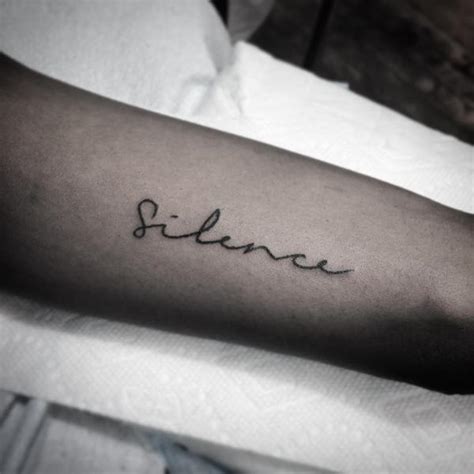 Silence tattoo on the arm - Tattoogrid.net