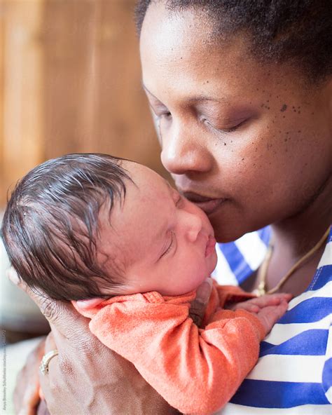 "A Black Mother Holding Her Biracial Newborn Baby Lovingly" by Stocksy Contributor "Anya Brewley ...