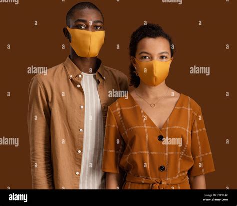 Front view couple with face masks Stock Photo - Alamy