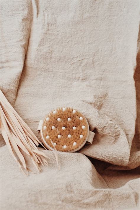 Brown and White Round Ornament on Brown Textile · Free Stock Photo