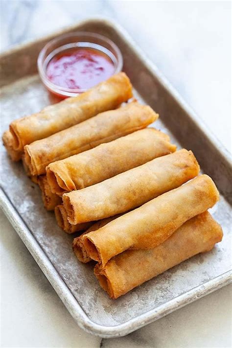 Lumpia or Filipino fried spring rolls on a plate with lumpia sauce, ready to be served. | Spring ...