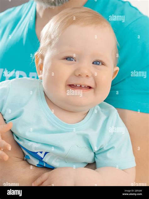Baby wearing blue hi-res stock photography and images - Alamy