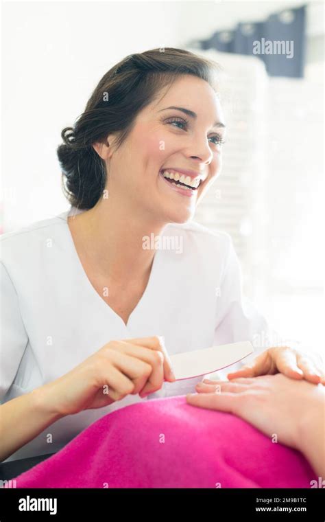 woman getting a manicure at a nail salon Stock Photo - Alamy