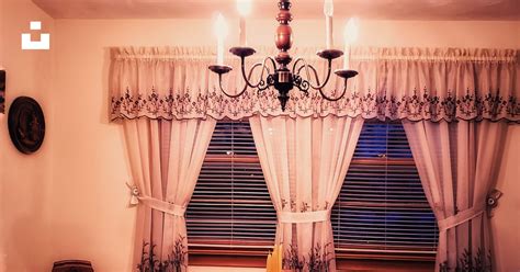 A dining room with a table, chairs and a chandelier photo – Free Ct Image on Unsplash
