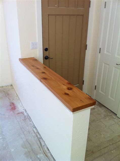 Pony wall with Alaskan Cedar cap, separates entry from living room in ...