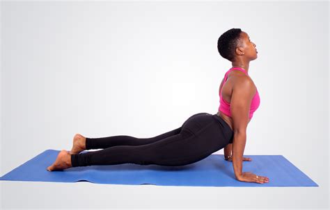 Fitness woman doing cobra yoga pose