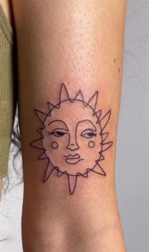 Sun outline tattoo