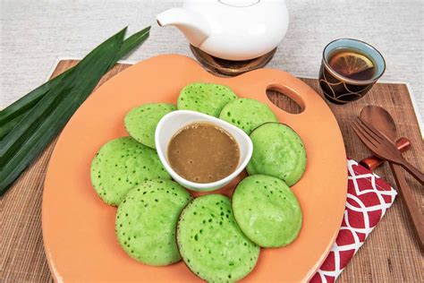 Surabi Manis Pandan is a traditional Indonesian snack commonly found in ...