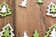 Photo of Festive frame of green Christmas tree ornaments | Free christmas images