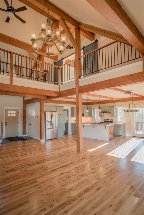 The Overlook is a post and beam open concept barn style farmhouse design. Visit to see more ...