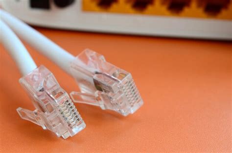 Premium Photo | Close-up of computer network cables and router on table