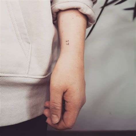 Hand poked number "17" tattoo done on the wrist.