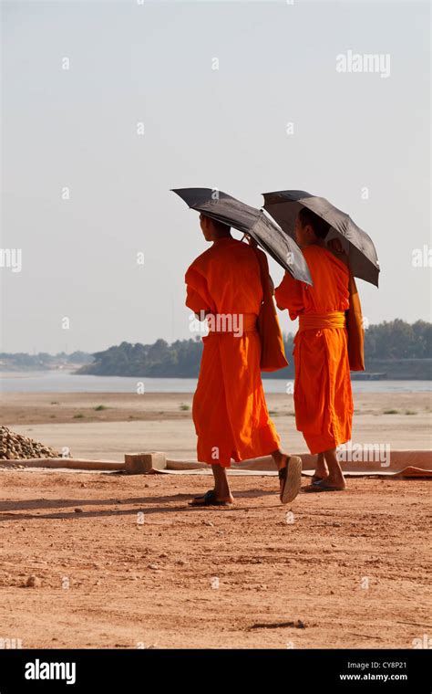 Buddhist monk walking along river hi-res stock photography and images - Alamy