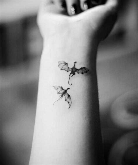 two-dragons-flying-small-wrist-tattoo-dragon-tattoo-design-black-white-photo | Dragon tattoo ...