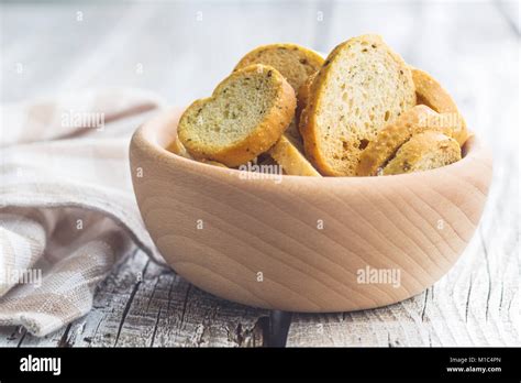 Crusty bread bruschetta in wooden bowl Stock Photo - Alamy