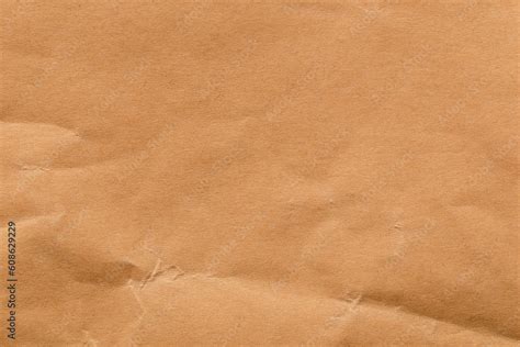 Brown color eco recycled kraft paper sheet texture cardboard background. Stock Photo | Adobe Stock