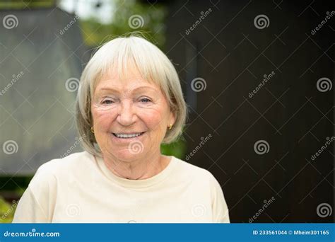 Happy Senior Woman or Grandmother Smiling at Camera Stock Photo - Image ...