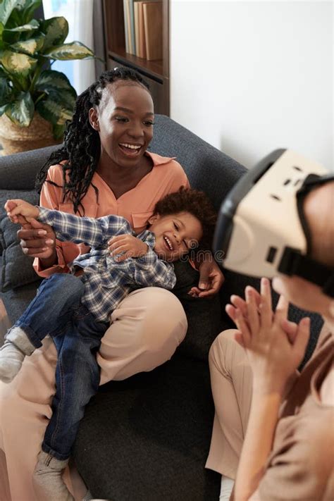 Family Playing VR Game stock image. Image of smiling - 244315137