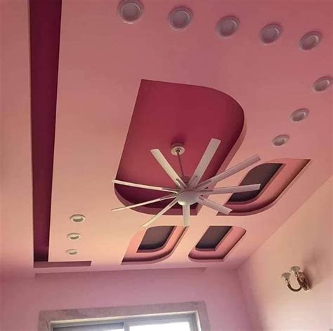 the ceiling is painted pink and has white circles on it