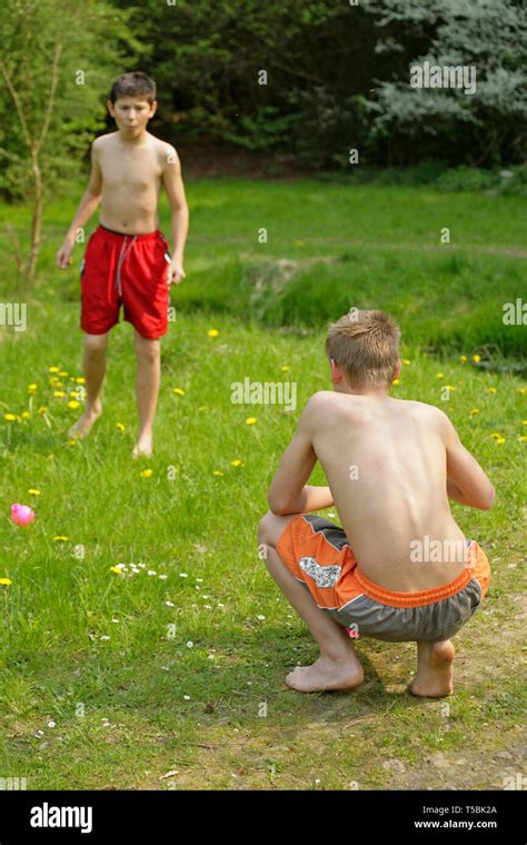 barefoot boys playing in nature Stock Photo - Alamy