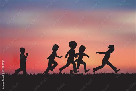 Silhouette, group of happy children playing on meadow, sunset, s Stock ...