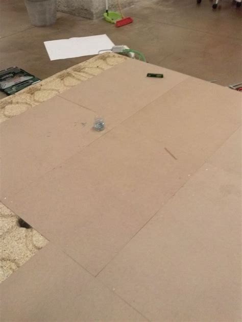 the floor is covered with cardboard and other items to make it look like they have been cut