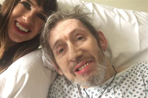 Shane MacGowan pictured smiling from hospital bed as he battles rare brain condition