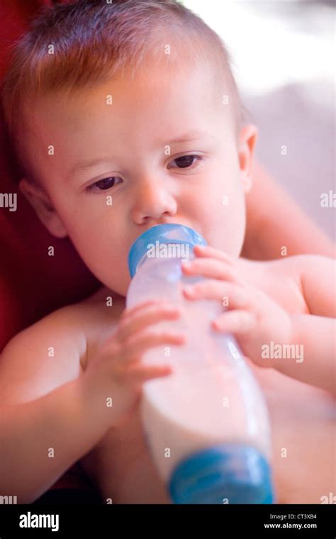 CHILD WITH BABY BOTTLE Stock Photo - Alamy