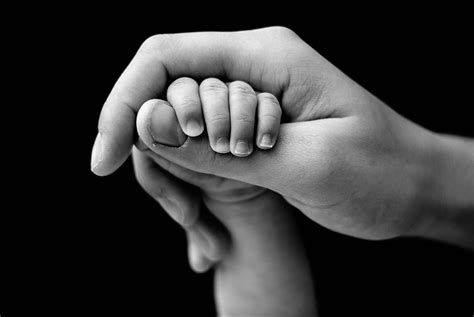 Hand in hand. Mother holding baby's arm. | Mother baby photography, Baby photography, Baby hands