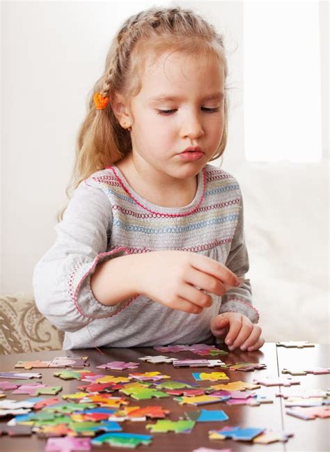 Girl playing puzzle stock image. Image of cute, person - 23401955