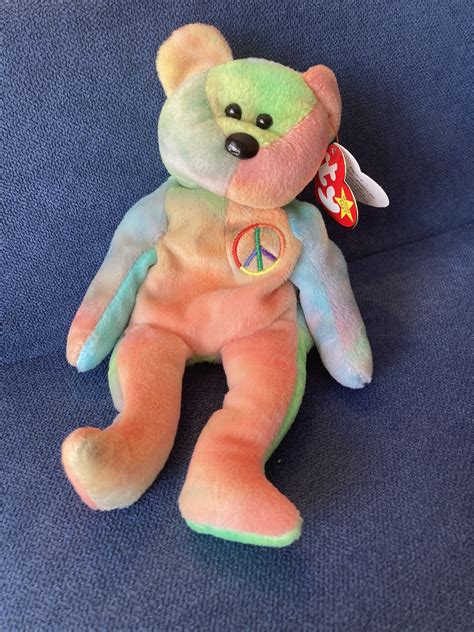 This is one of the RAREST Beanie Babies I've come across! This is a Peace the Bear Beanie Baby ...
