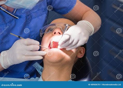 Dentist Examining a Patient with Angle Mirror and Sickle Probe Stock Photo - Image of occupation ...