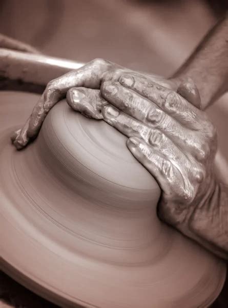 Hands working on pottery wheel — Stock Photo © GPimages #48381055