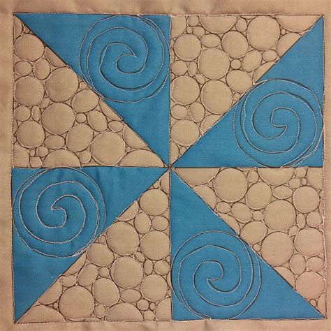 Josh's Spirals & Pebbling in a Pinwheel Block | Free motion quilt designs, Machine quilting ...