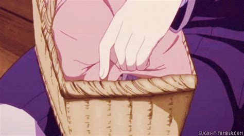 a person sitting in a chair with their hand on the basket
