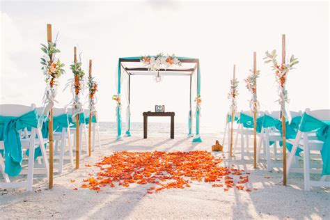 Turquoise and orange beach wedding. | Beach theme wedding, Beach wedding red, Beach wedding