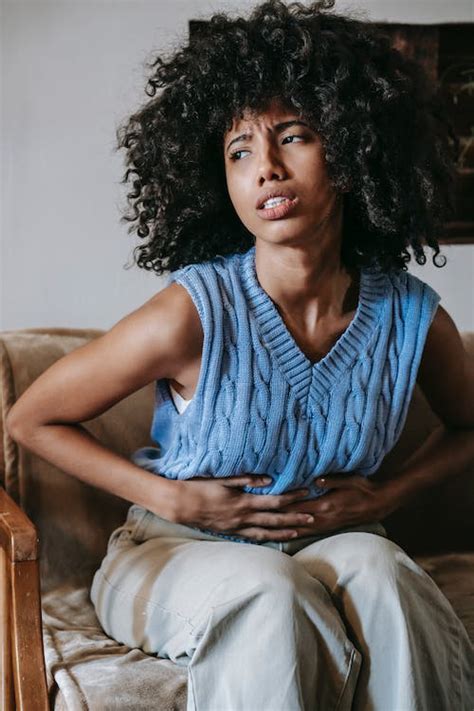 Black woman having pain in stomach · Free Stock Photo