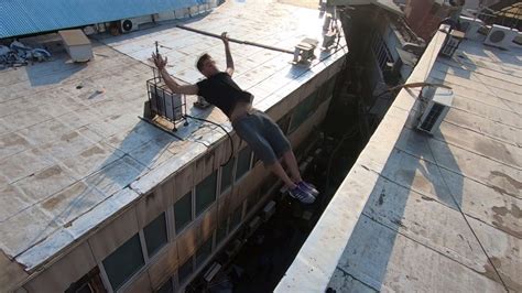 Iranian daredevil does death-defying parkour moves off the sides of ...