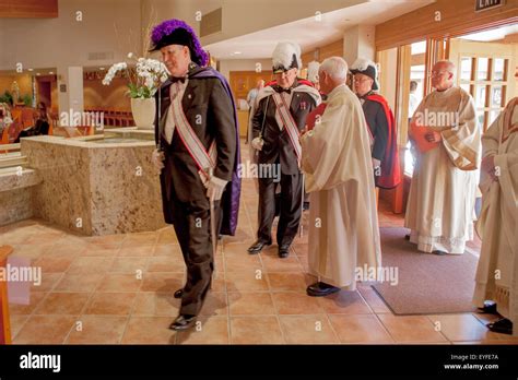 Wearing their ornate formal uniforms and carrying swords, fourth degree members of the Knights ...